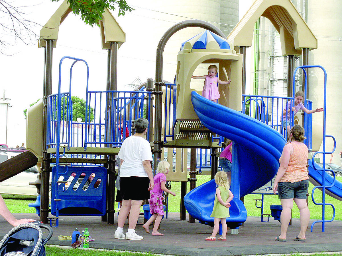 kids playing on the new playground equipment